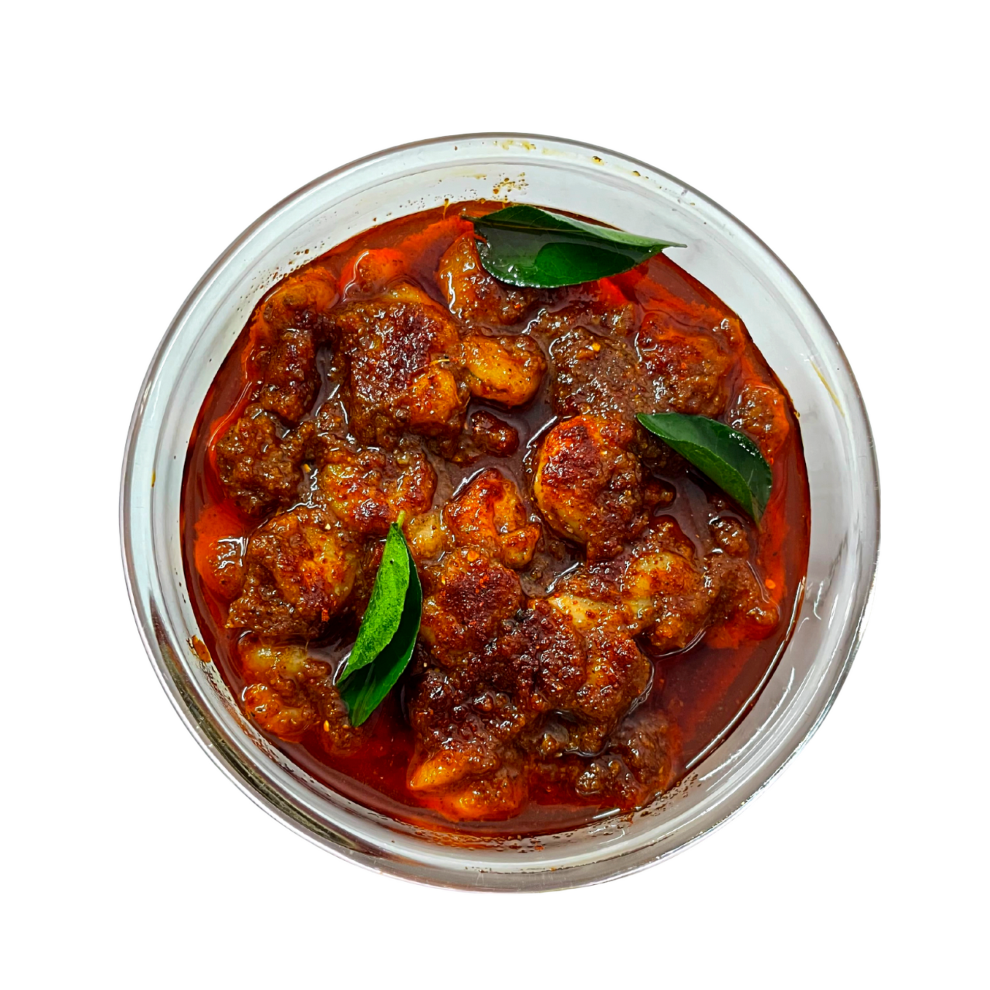 Top view of Octorika prawn pickle in a transparent glass bowl, garnished with curry leaves and rich red masala
