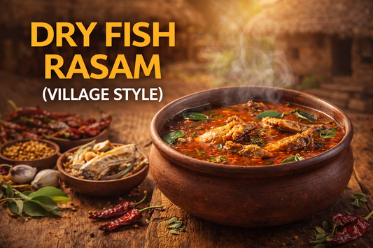A rustic clay pot filled with steaming Dry Fish Rasam (Village Style), garnished with curry leaves and dried red chilies, placed on a wooden village-style table with dry fish, garlic, and spices arranged around it in a warm South Indian setting