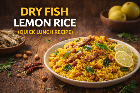 A vibrant plate of Dry Fish Lemon Rice topped with roasted dry anchovies, peanuts, curry leaves, and lemon slices, placed on a rustic wooden table with dried red chilies, whole lemons, and a small bowl of dry fish in the background