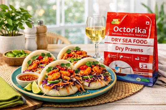 Freshly prepared dry prawns bao buns served on a modern restaurant table, filled with spicy dry prawns, crunchy cabbage slaw, herbs, and chili, with an Octorika Dry Prawns packet placed beside the plate in bright natural daylight