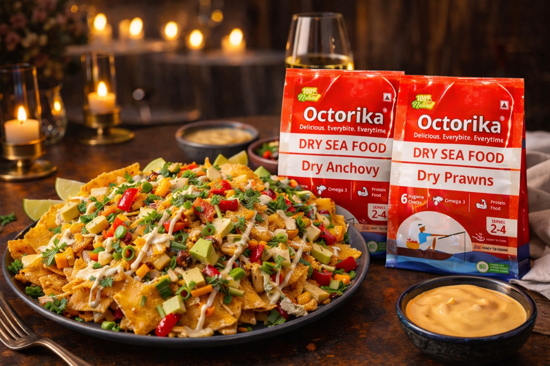 a plate of Spicy Dry Fish Nachos topped with crispy dry fish flakes, avocado, corn, herbs, and creamy sauce, served on a gourmet table with Octorika Dry Anchovy and Dry Prawns packets placed beside the dish