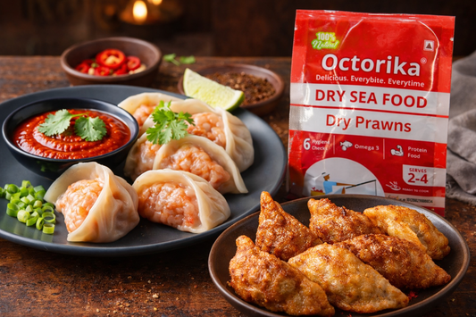 a plate of steamed dry prawn momos with spicy red dipping sauce, garnished with spring onions and herbs, alongside crispy fried momos on a wooden board, with an Octorika Dry Prawns packet placed on a candle-lit gourmet table setting