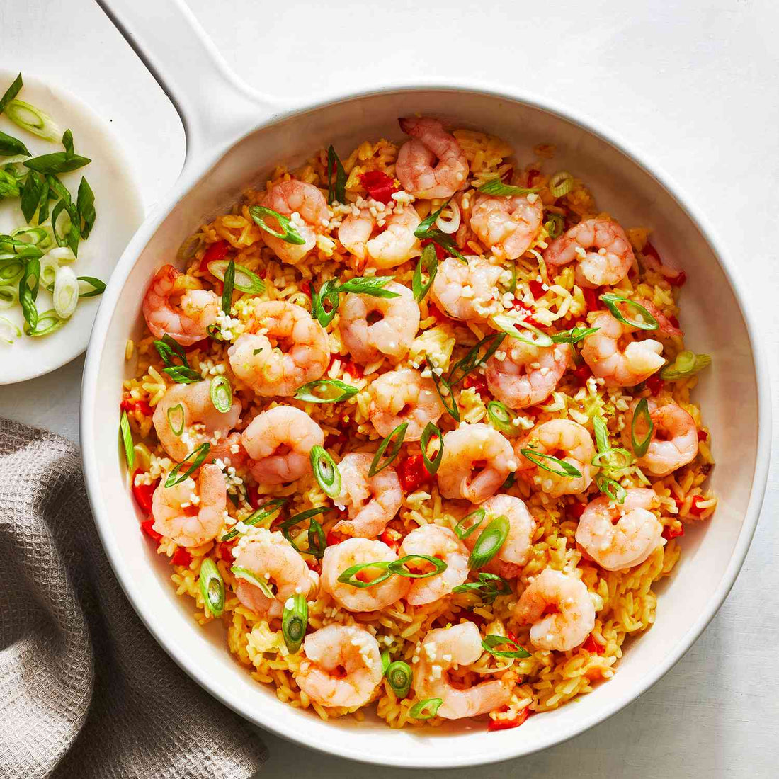 Close-up bowl of dry prawn garlic butter rice garnished with fresh coriander, showing golden buttery rice mixed with crispy dry prawns and sautéed garlic