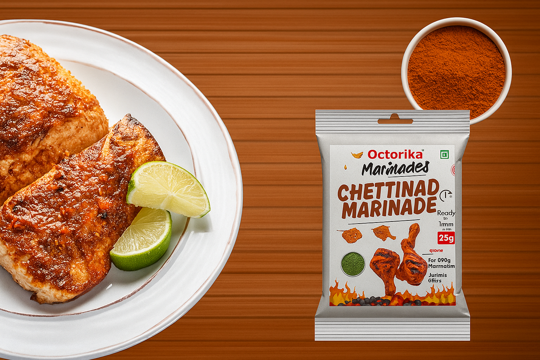 A high-resolution image showing two beautifully marinated and grilled fish fillets served on a white plate with lime wedges, placed beside a packet of Octorika Chettinad Marinade and a bowl of its rich, red spice blend on a wooden background
